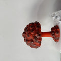 Mushroom cloud shaped modern art table lamp with USB power cable on a table.