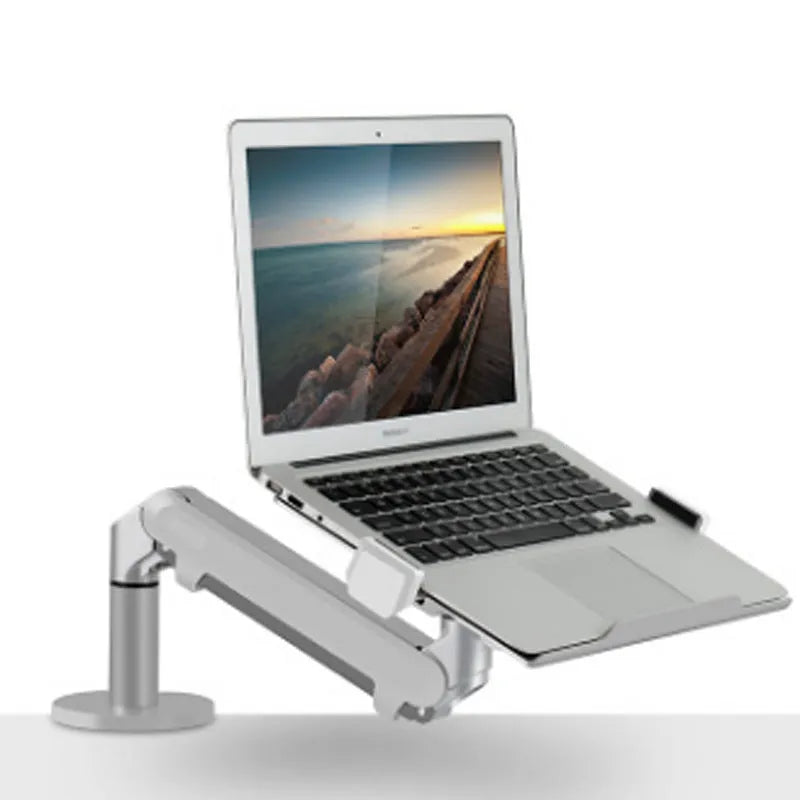 Silver aluminium hover arm laptop stand with adjustable height mechanism on wooden desk