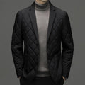 A man wearing a solid-colour thick down jacket with a lapel and side seam pockets.