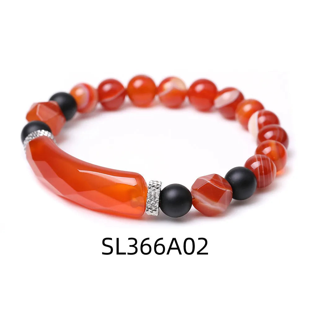 Handmade black agate diamond cut bracelet with geometric fan design on wrist