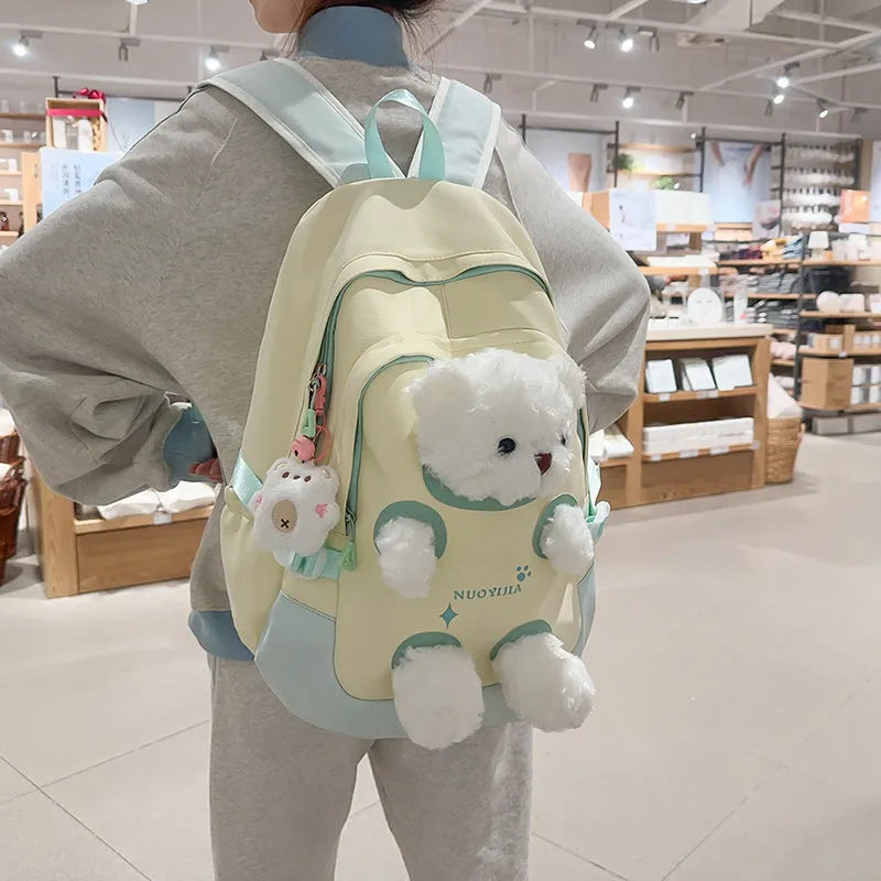 Nylon school backpack in macaron colour with curved shoulder strap and pendant, 20-35L capacity
