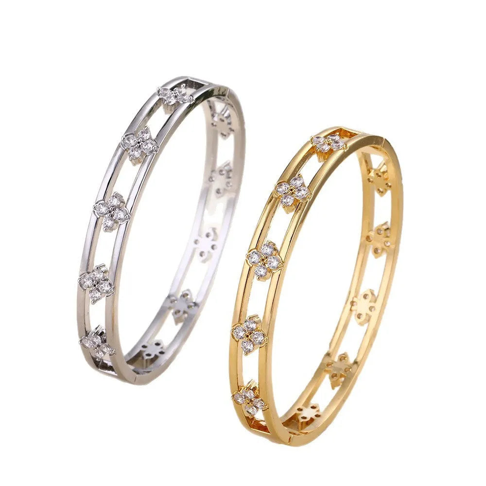 Gold and silver hollow women's bracelets with inlaid zircon stones and four-leaf clover designs.