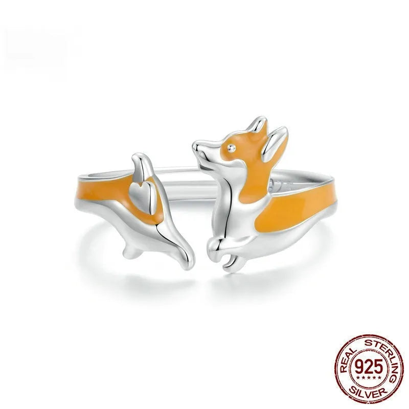 Silver-coloured adjustable ring with a detailed cartoon Corgi dog design.
