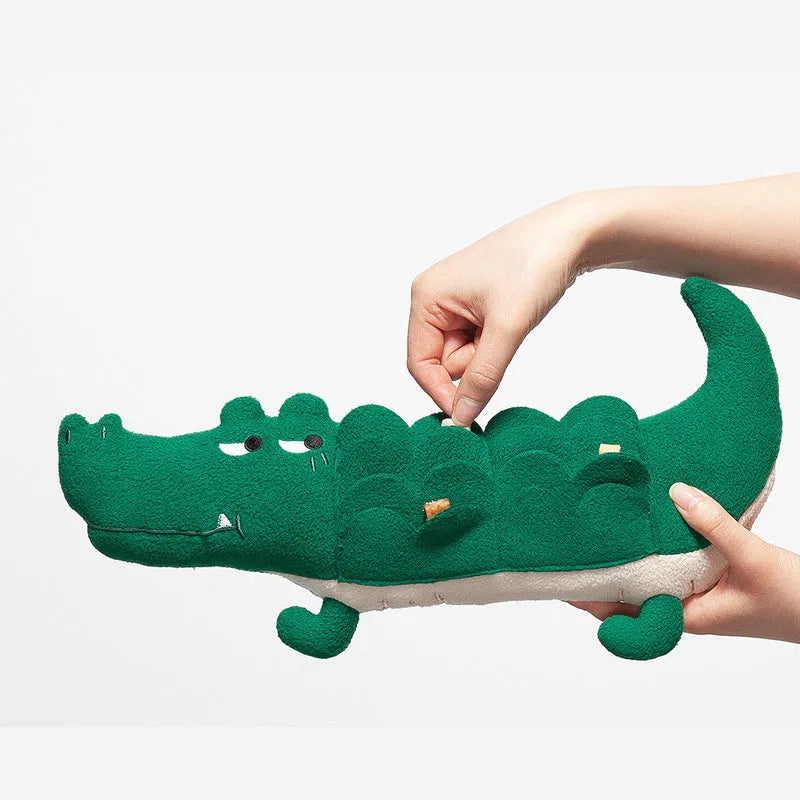 Green plush dog toy with squeaker measuring 35cm long on white background