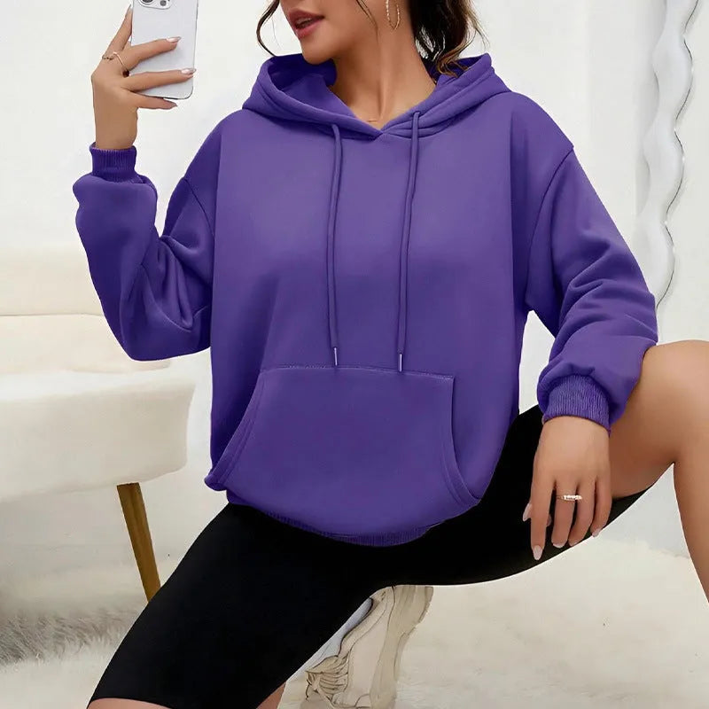 Women's loose grey sweatshirt with drawstring pockets and long sleeves