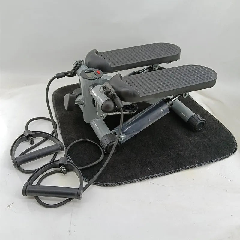 Silver grey hydraulic resistance mini treadmill and pedal machine for home gym waist slimming workouts.
