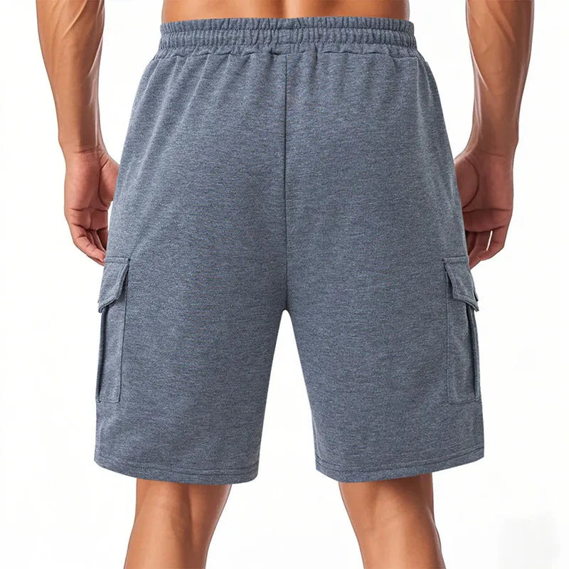 Men's loose grey Terry fabric cargo shorts with multiple pockets and elastic waist
