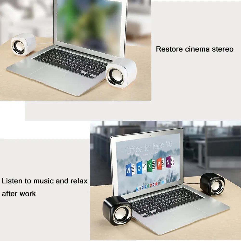 Pair of small black wired desktop computer speakers with volume wheel
