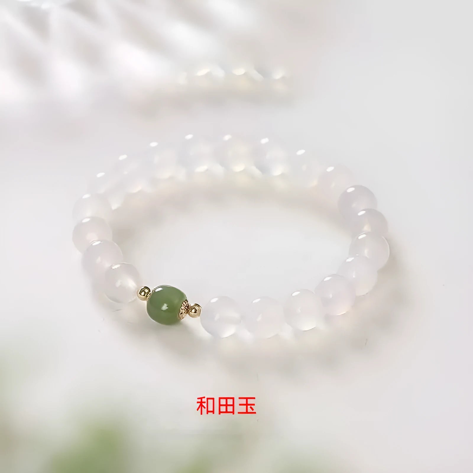 Handmade white agate crystal bracelet with cinnabar inlay showing 6mm and 8mm bead size options