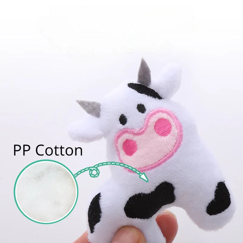 Plush green parrot-shaped cat toy with catnip, shown next to cow and crocodile versions.