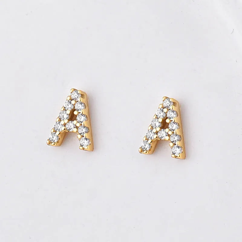Gold plated alphabet letter earrings showing single English character with zircon decoration on brass base