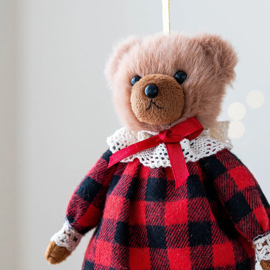 Cartoon plush bear doll wearing a cotton suit with a plaid print, in two colour options.