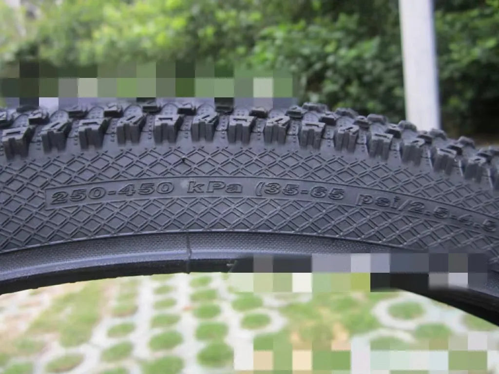 Ultralight puncture-proof mountain bike tyre shown in multiple sizes including 26, 27.5 and 29-inch options.
