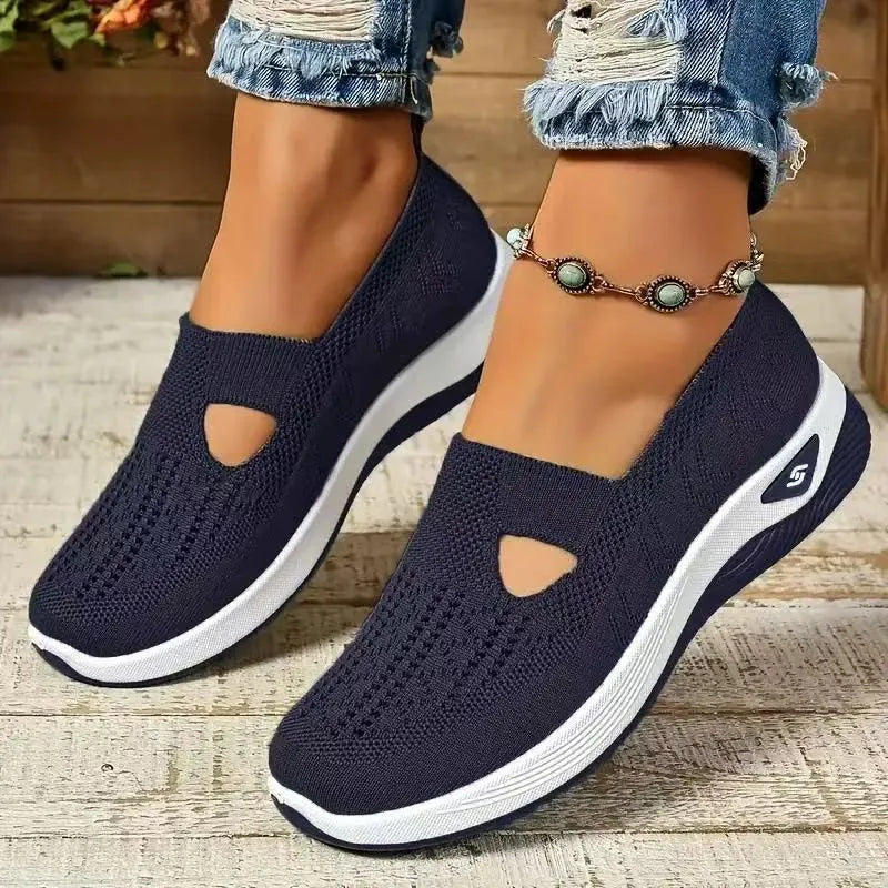 Women's casual mesh shoes with T-strap in various colours showing round toe and flat heel design