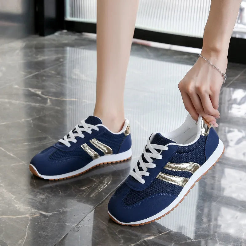 Blue women's casual sports shoes with cross shoulder straps and flat rubber sole