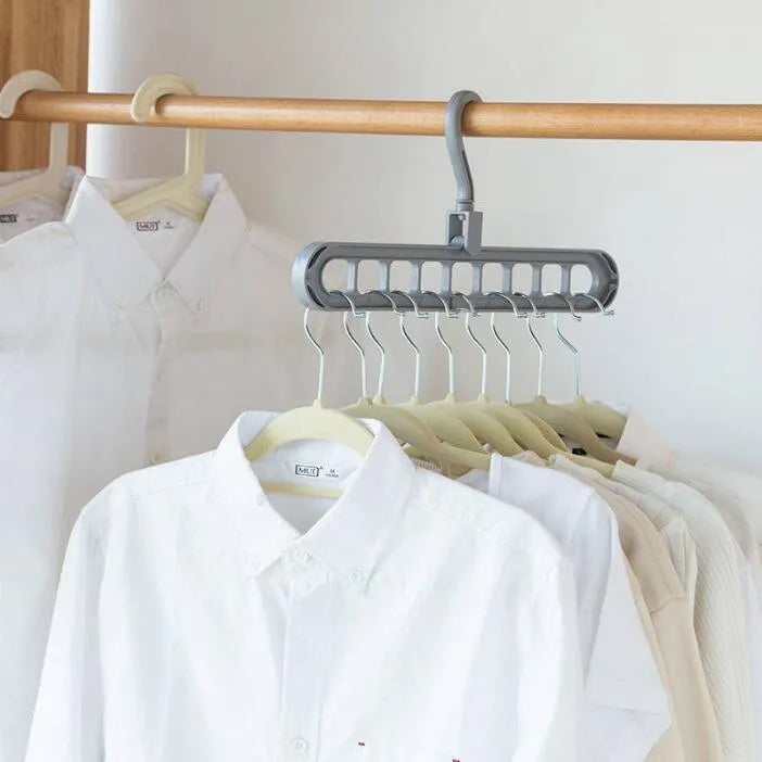 Plastic clothes hanger with rotating hook showing pink and green colour options