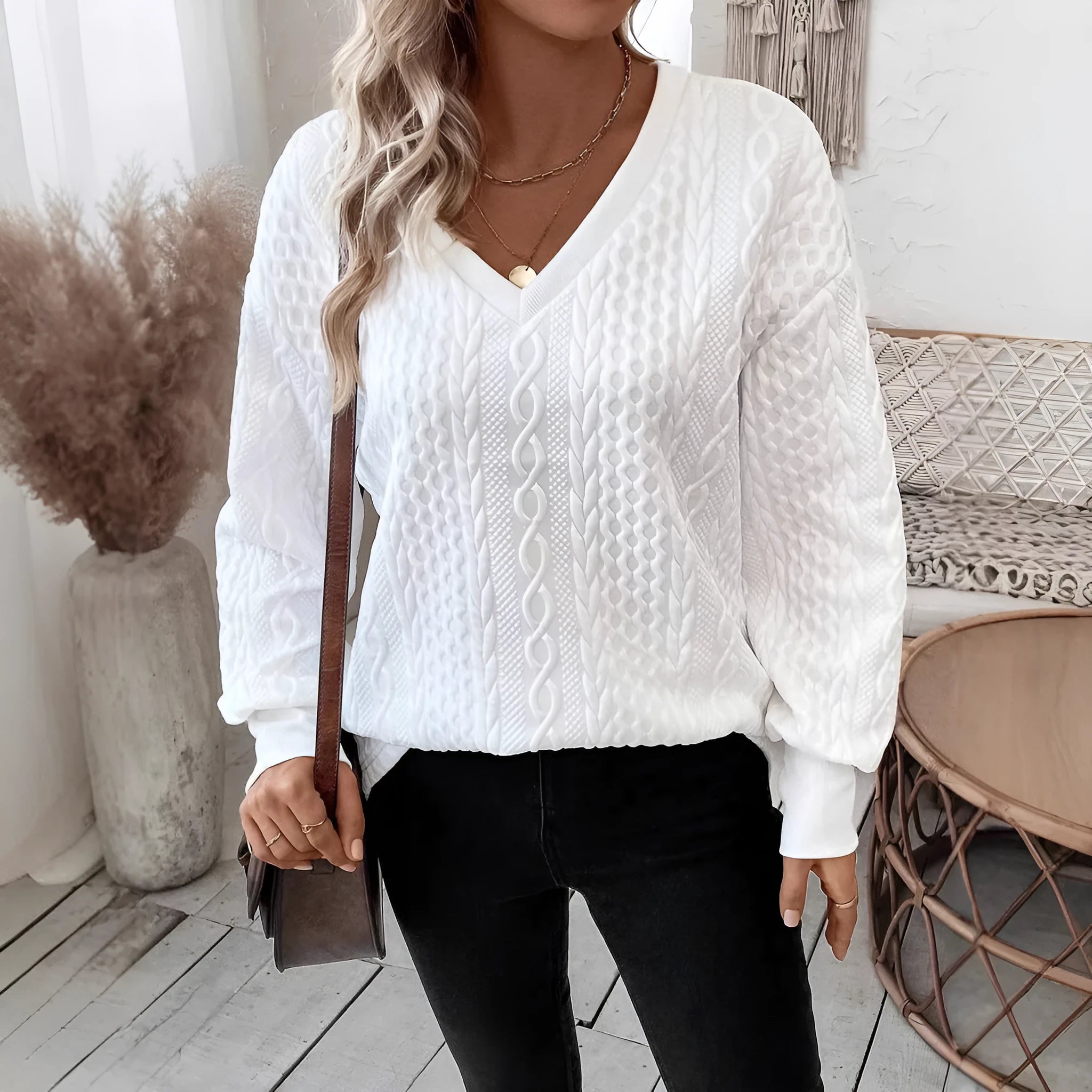 Milky white loose fit long sleeve T-shirt with 3D pattern detail on mannequin