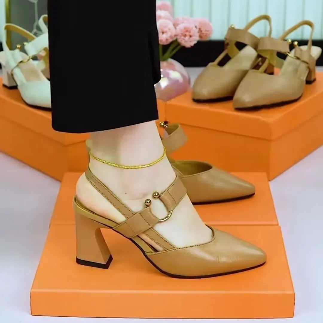 Women's apricot coloured closed toe leather sandals with a chunky rubber heel on a white background.