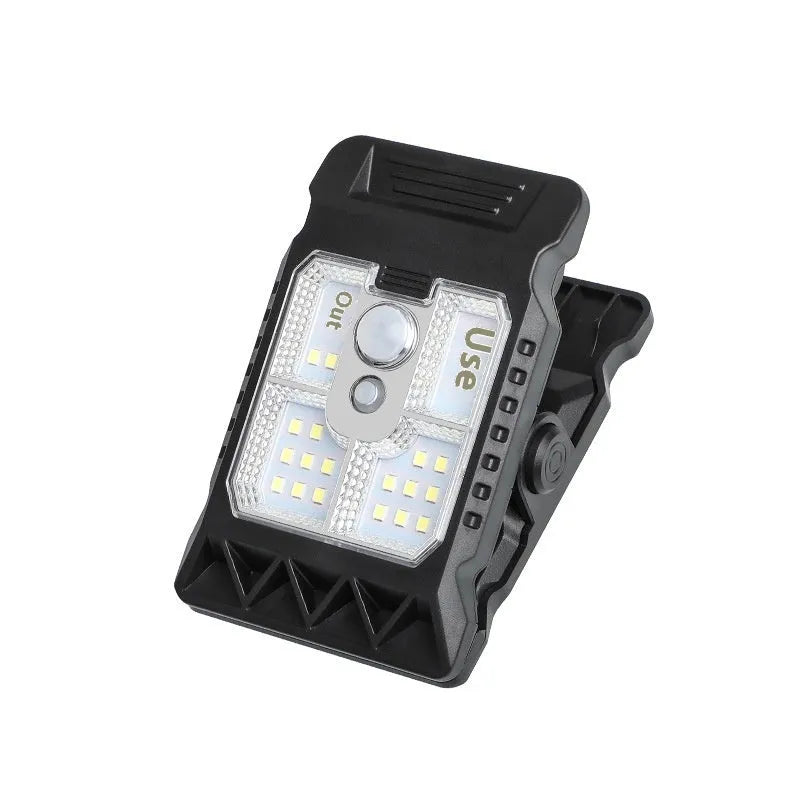 Black intelligent induction clip lamp with flexible gooseneck, shown clipped to a shelf.