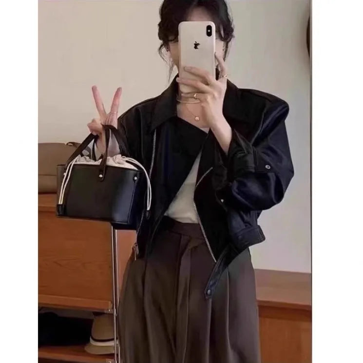 Women's brown retro imitation leather jacket with long sleeves, slim fit, and pockets.
