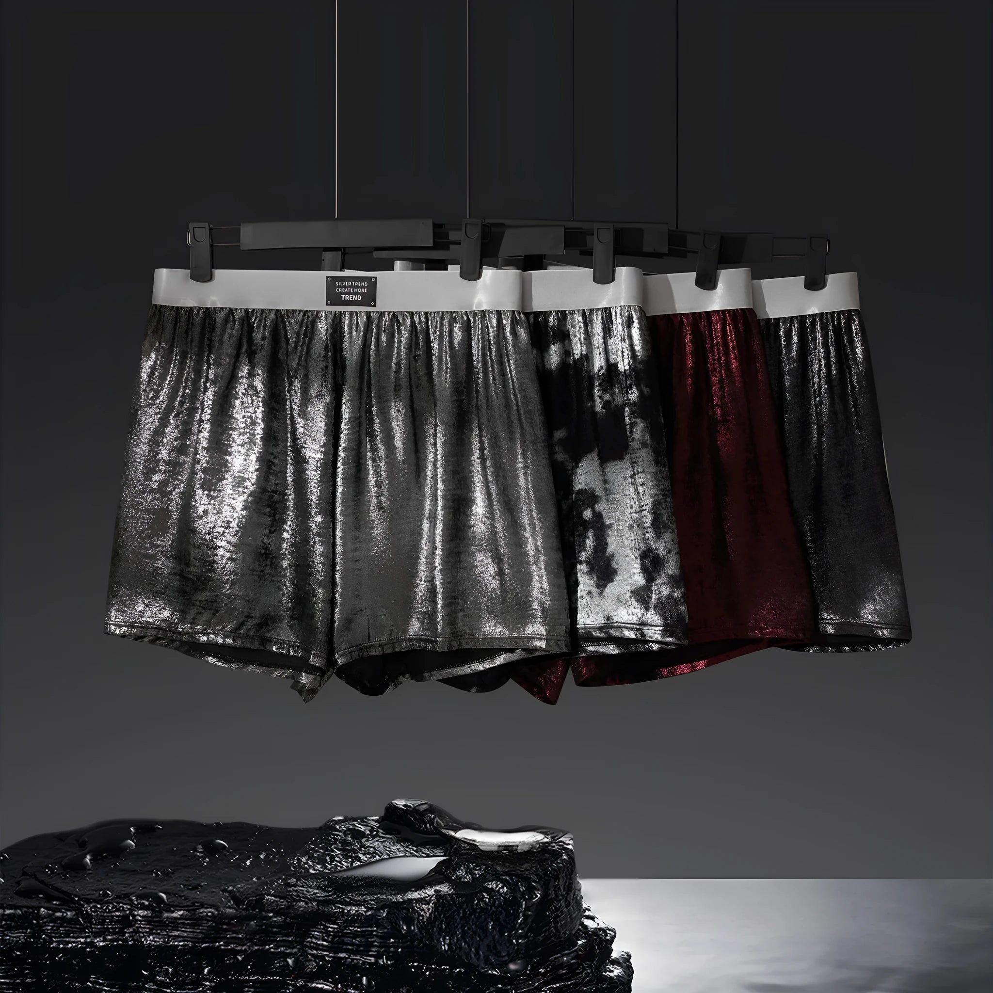 Men's bright silver reflective loose sports boxers in red, black, silver, and multicolour options.