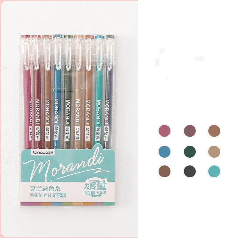 Set of nine colourful retro gel pens with 0.5mm needle tips, shown alongside a notebook.