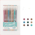 Set of nine colourful retro gel pens with 0.5mm needle tips, shown alongside a notebook.