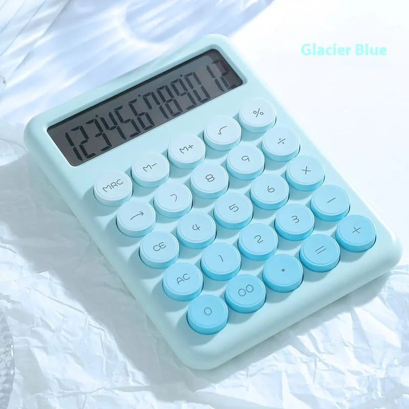 Gradient colour desk calculator in violet, cherry blossom pink, blue, or mint green on a desk.