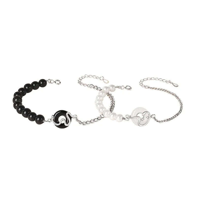 A pair of 925 sterling silver bracelets for men and women featuring a snake zodiac charm and a safety buckle clasp.