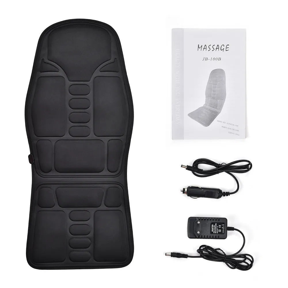 Black electric cervical vertebra massager with wireless remote control on a table.