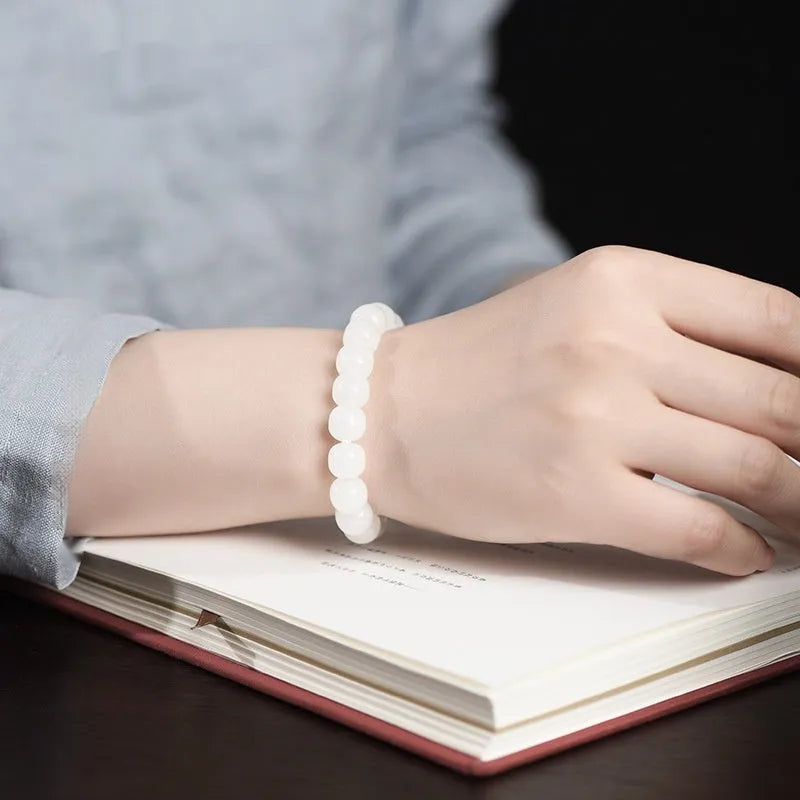 White jade barrel beads bracelet on wrist showing Hetian jade beads in casual unisex design