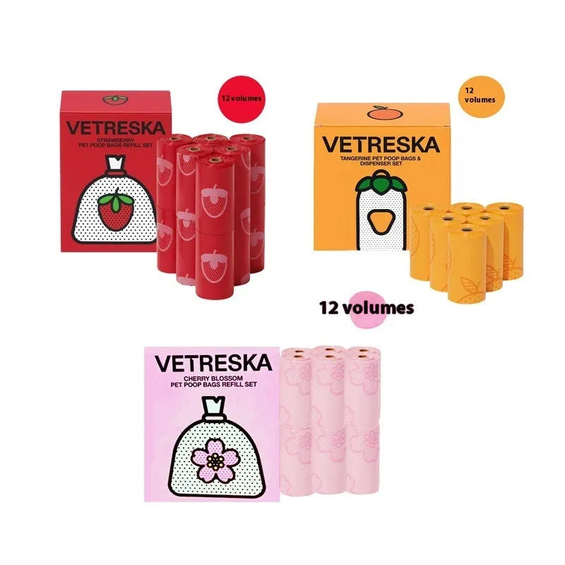 Portable dog waste bag dispenser capsule with scented inner bags in strawberry, orange, and cherry blossom options