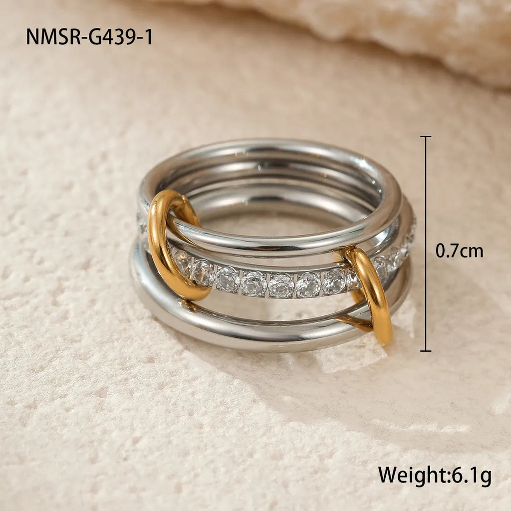 Gold plated stainless steel stacked ring set for women in an exaggerated design.