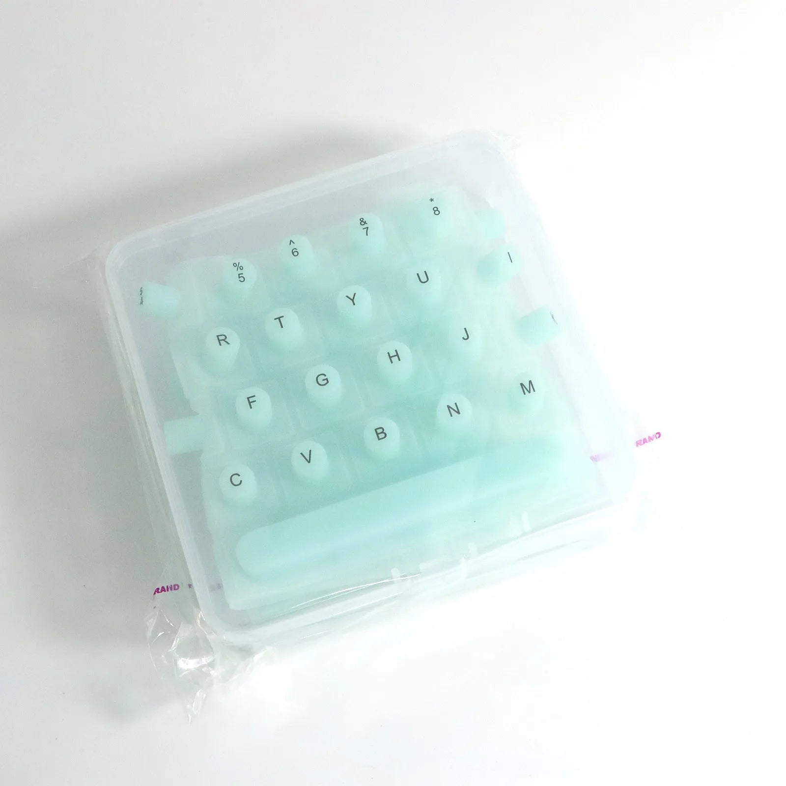 70 anti-static silicone keycaps for long nails in assorted colours including black, clear, mint green, pink, and purple