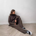 Women's acrylic suit set with side-slit sweater and matching trousers in solid colour
