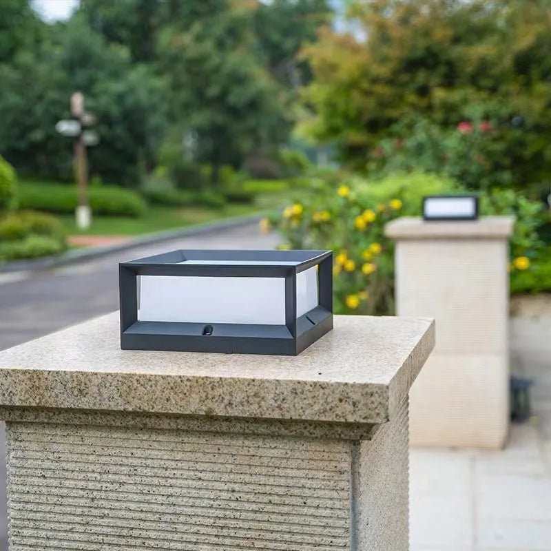Aluminium outdoor solar column light with LED, shown in garden setting.