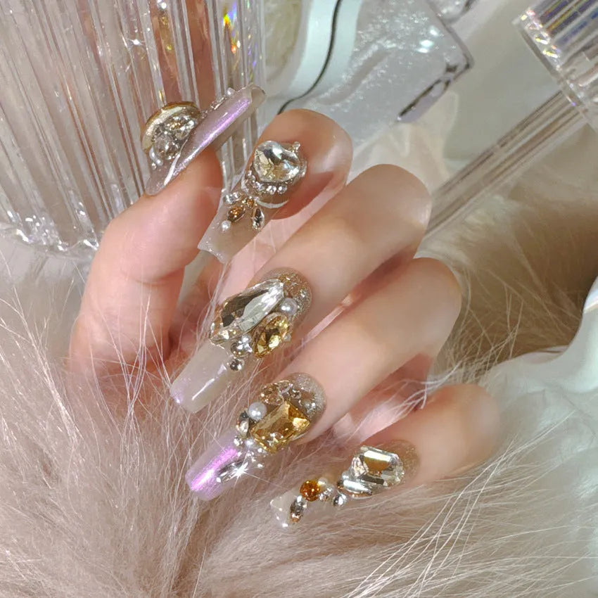 Rhinestone-decorated false nail patches with application kit options on card packaging