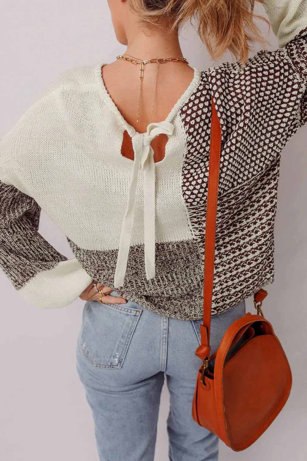 Dark khaki loose drop shoulder sweater with colour block panels and a back tie detail.