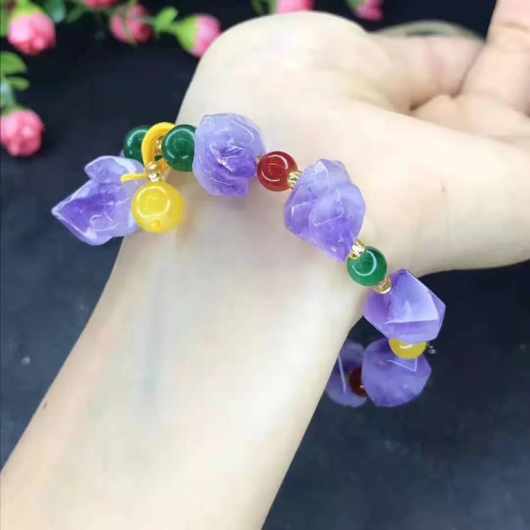 Natural amethyst bracelet with fu charm on woman's wrist