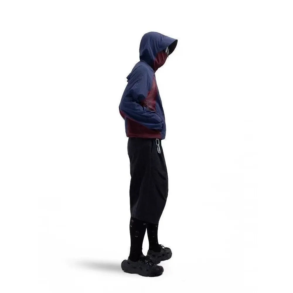 Nylon sun protective top with mesh stitching in desert brown, light grey, red and blue colours.