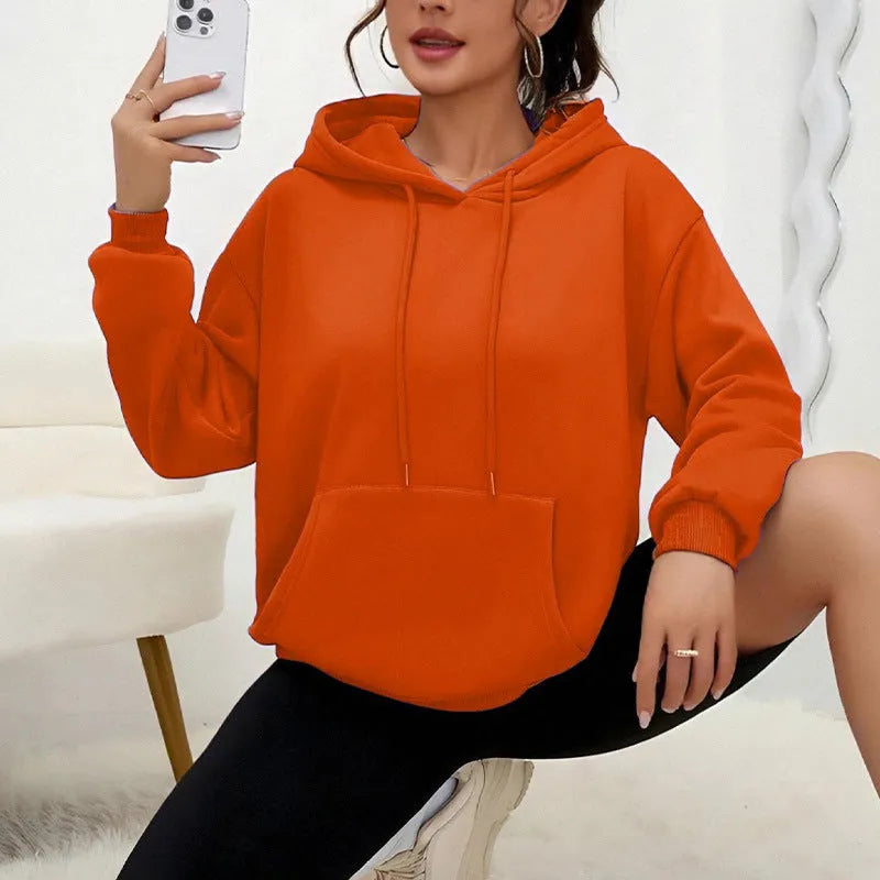 Women's loose grey sweatshirt with drawstring pockets and long sleeves