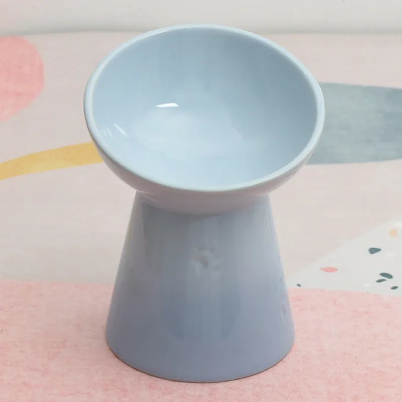 Ceramic pet bowl with high foot design showing anti-tumble stability feature