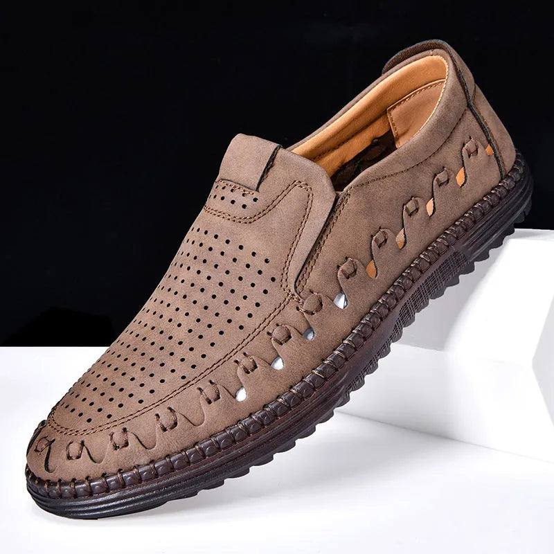 Men's brown casual slip-on shoes with round toe, hollowed detail, and sewn sole on a neutral background.