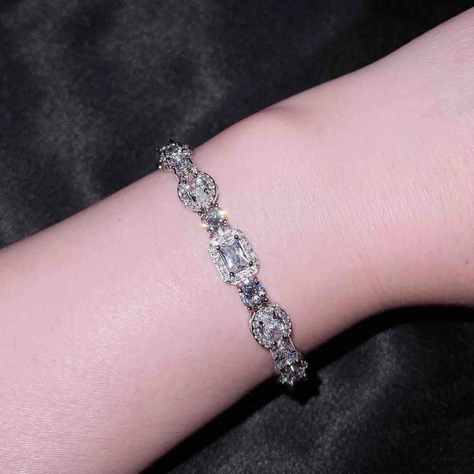 Women's geometric bracelet with S925 sterling silver plating and inlaid zircon stones showing adjustable chain
