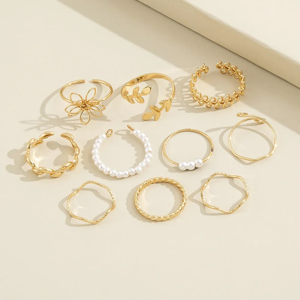 Women's alloy openwork flower ring with glossy electroplated gold finish