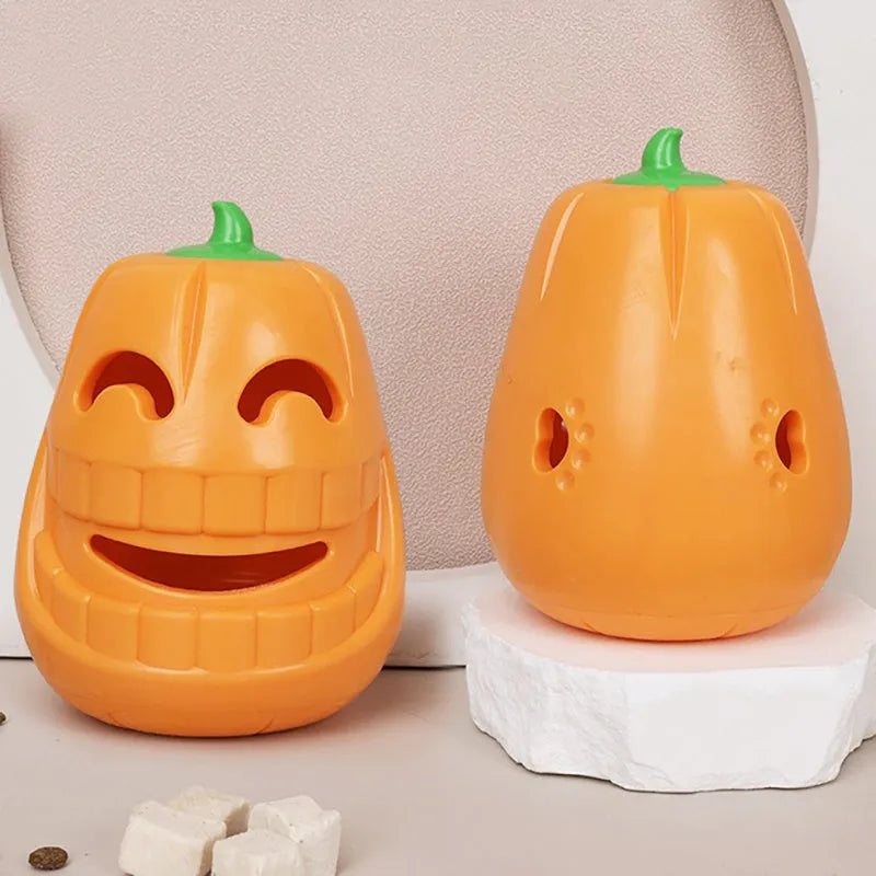 Orange Halloween pumpkin shaped dog chew toy with a treat-dispensing funnel hole.