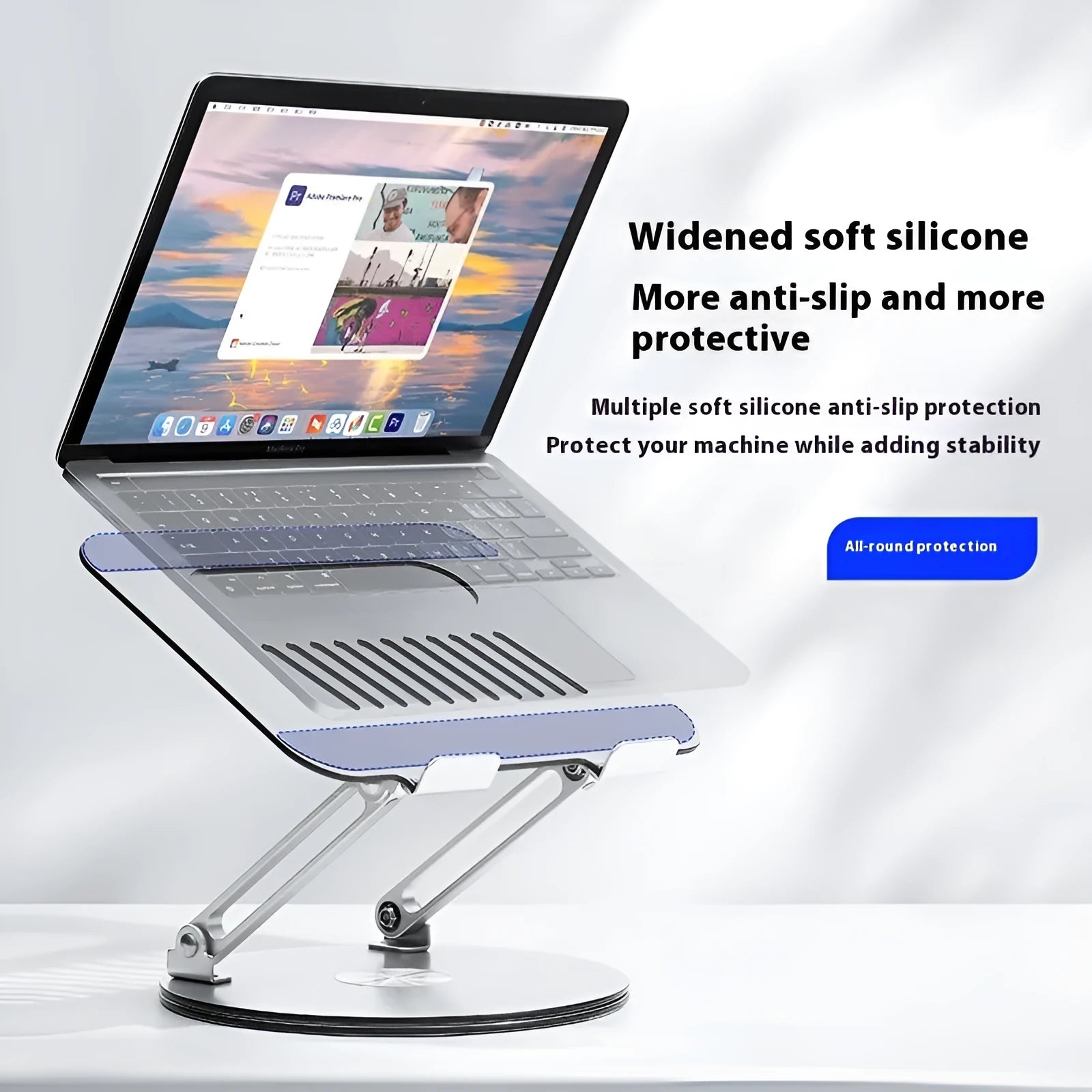 Silver aluminium alloy laptop stand with rotatable top and foldable design on desk