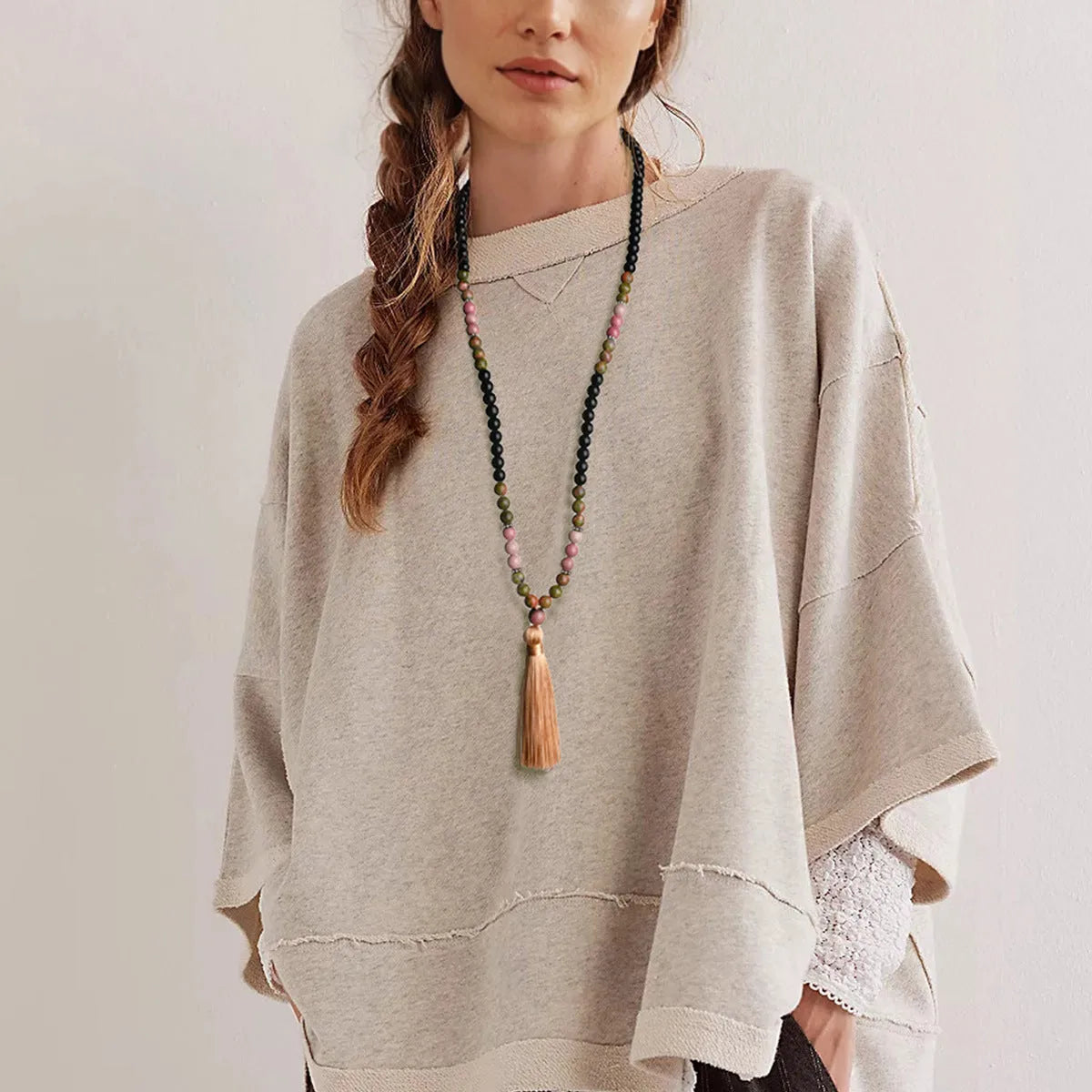 Long handmade Bohemian necklace with a natural stone tassel and mixed gem geometric pendant on an 81cm chain.