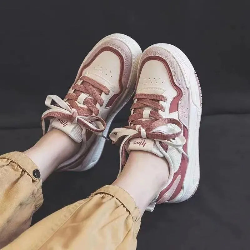 Low top sneakers with rubber sole in pink, milky white, and beige colours
