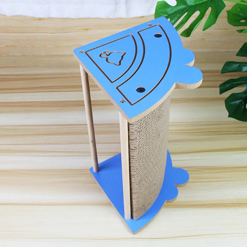 Grey cardboard cat corner scratching post with hanging yellow ball in a room corner.